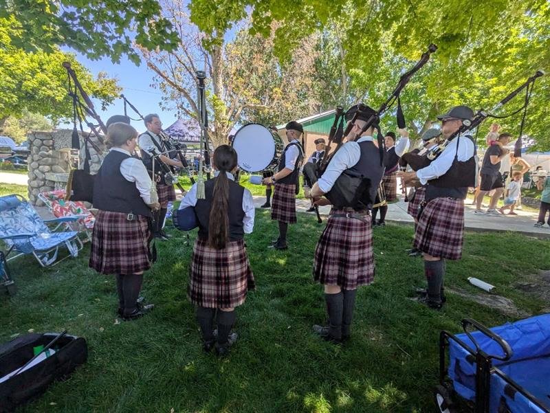 The band tuning up under the trees
